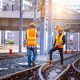 Rail workers on train tracks