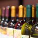 Close up photo of wine bottles on a shelf