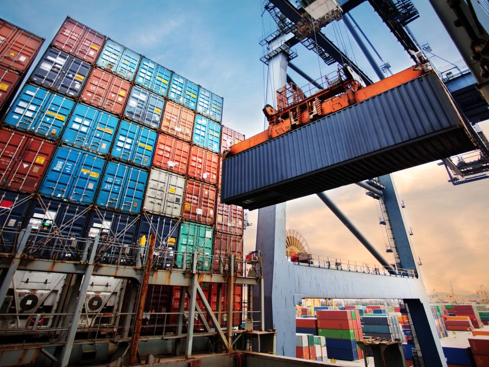Container loading in a Cargo freight ship with industrial crane.