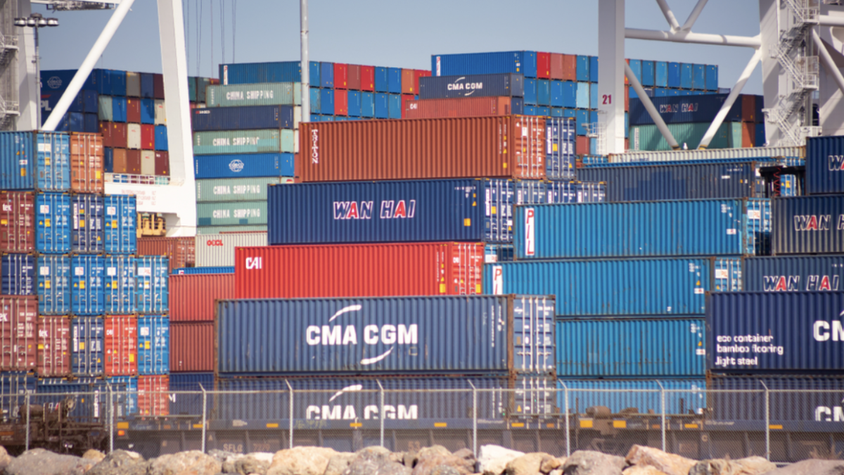 A picture of shipping carts stacked on top of each other at a port.