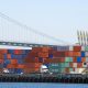 Shipping containers stacked on docks at shipping port in Los Angeles.