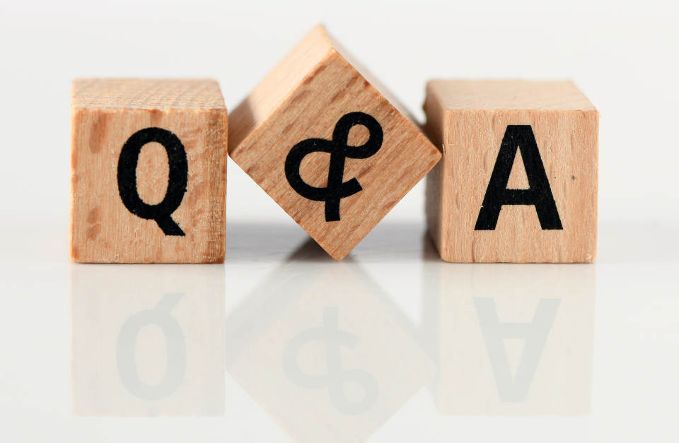 Wooden blocks with the letters Q and A.